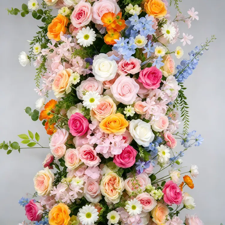 Close-up Colorful Floral Pillar Pink Magenta Roses White Daisies Orange Yellow Blue Delphinium Greenery