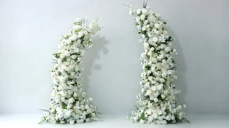 White Rose Floral Pillar Set Curved Wedding Flower Columns Framing Ceremony Aisle Light Grey Wall