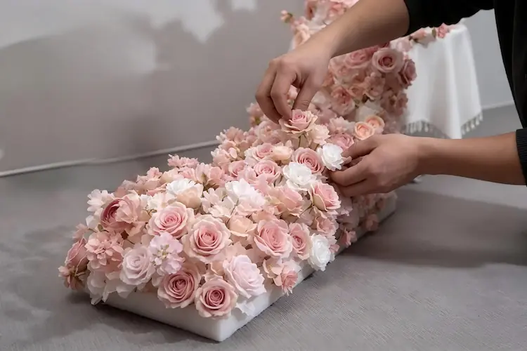 artisan handcrafting artificial flower runner