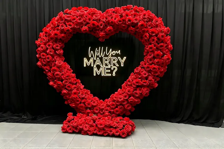 will you marry me sign with flower arch complete proposal set
